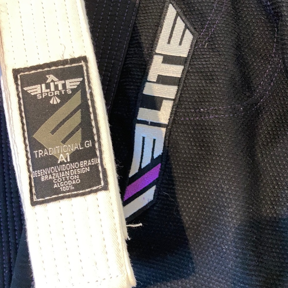 Black and purple Brazilian Jiu Jitzu Gi with white belt.